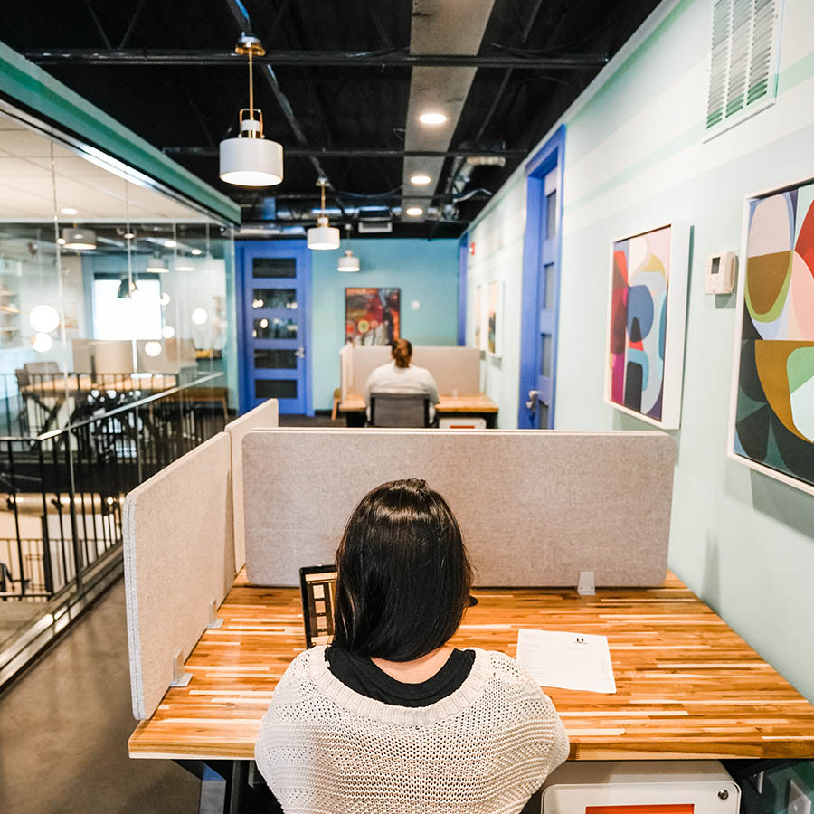 person working at desk at Catalyst Coworking