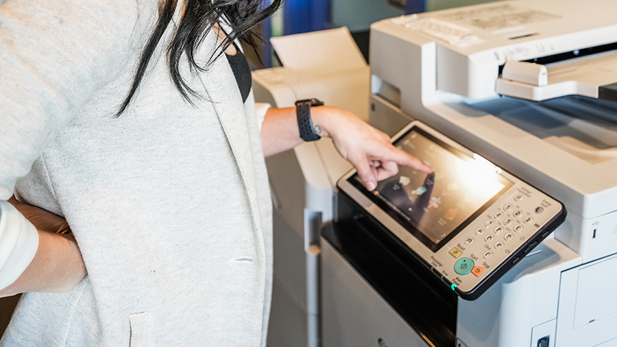 Woman using printer at Catalyst Coworking